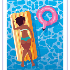 woman afro tanning in float on the pool