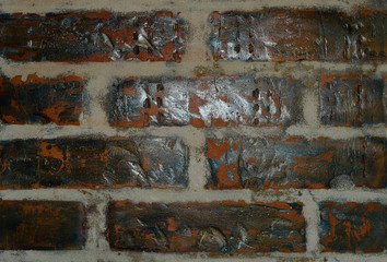 Brick wall of old cracked brick