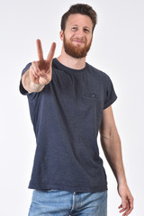 man making the victory sign on a white background