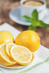 Fototapeta na wymiar Fresh lemons on the old table