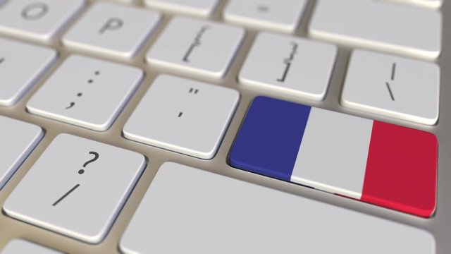 Key with flag of the Dominican Republic on the computer keyboard switches to key with flag of France, translation or relocation related animation