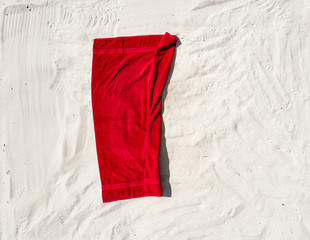 Aerial view of red towel on beach 