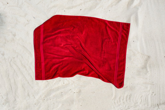 Aerial View Of Red Towel On Beach 