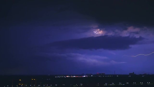 The bright lightning above the night city