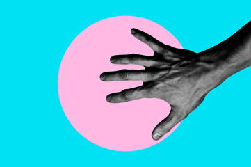 Isolated on blue background black and white man hand photo on pink circle. Surrealistic collage style, contemporary art element for design, posters and banners. Cotton candy pop colors. Magazine style