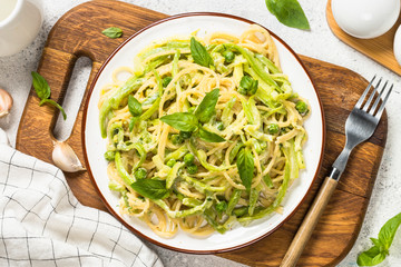 Pasta spaghetti with zucchini top view.