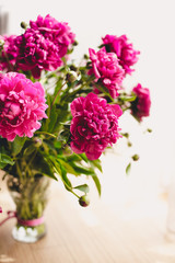 Elegant bouquet of a lot of peonies of pink color close up. Beautiful flower for any holiday. Lots of pretty and romantic flowers in floral shop. Bouquet of a lot of peonies of pink color close up.