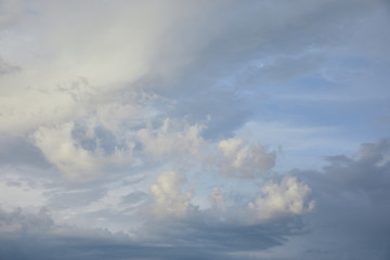 Naklejka na ściany i meble view of white and grey clouds on blue sunlight sky background