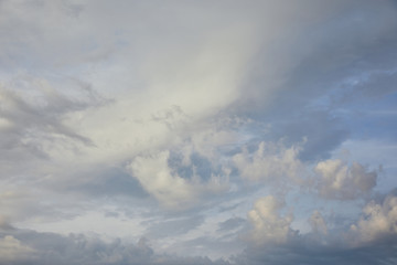 Naklejka na ściany i meble view of white and grey clouds on blue sunlight sky background