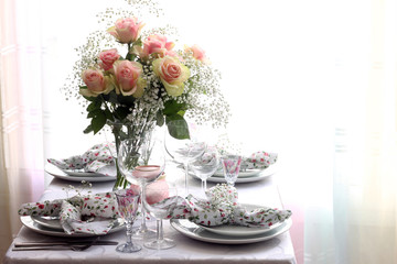 Beautiful holiday table setting with flowers