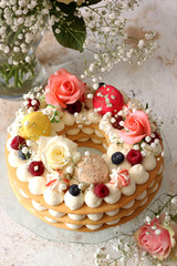 Beautiful homemade cake  , decorated with flowers and berries