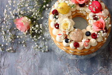 Beautiful homemade cake  , decorated with flowers and berries