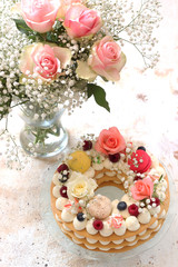 Beautiful homemade cake  , decorated with flowers and berries