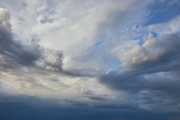 Naklejka na ściany i meble view of peaceful grey sky background with white and dark clouds