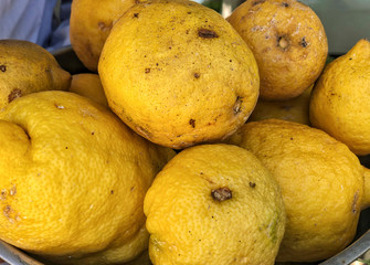 pile of organic yellow lemons