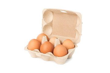 Brown chicken eggs in carton box isolated on white background