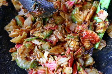 shaved rujak. Indonesian fruit salad with hot spicy sauce. the process of making from kneading spices, until served