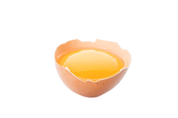 Half broken egg with yolk isolated on white background