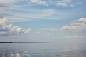 Landscape with river and clouds on blue sky