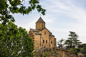 Fototapeta premium Tbilisi, Georgia. Church building architecture sunset view.