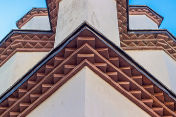 Close up symmetric shoot of masonry structure mosque with oriental ordered bricks under roof