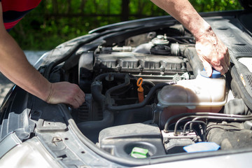 car repair open hood worker