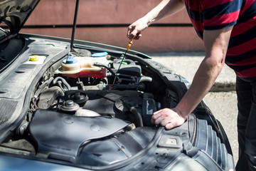 Fototapeta na wymiar car repair open hood worker