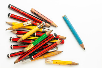 Naklejka premium Old Pencils on White Paper