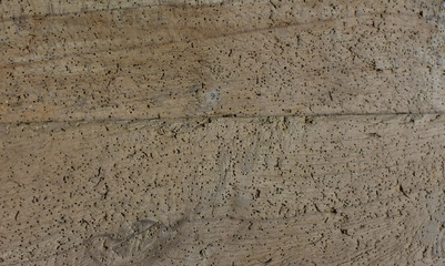 Close-up of very old wooden desk, table. Full of small holes. With textures. Wooden  surface suitable as background.