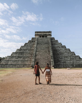 couple stand near stairs