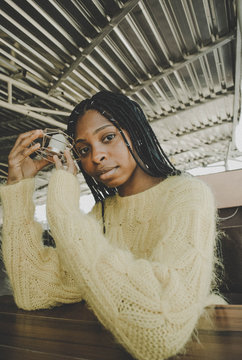 selective focus photography of woman leaning on table