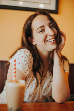 shallow focus photo of woman on white shirt smiling