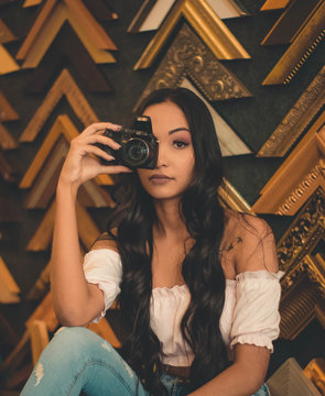 woman holding DSLR camera