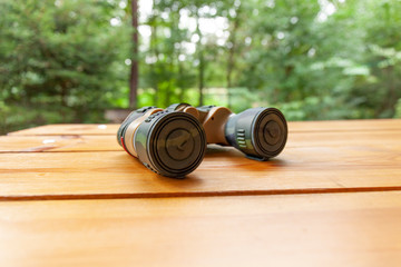 Close up of Closed binoculars on a Table