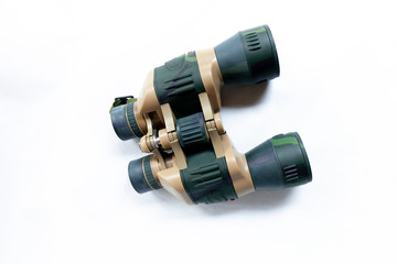 Binoculars are laying on a white background