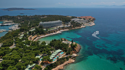 Fototapeta premium Aerial drone bird's eye panoramic photo of famous celebrity sandy beach of Astir or Asteras in south Athens riviera with turquoise clear waters, Vouliagmeni, Greece