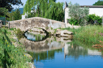 Bridge of a village. Water.