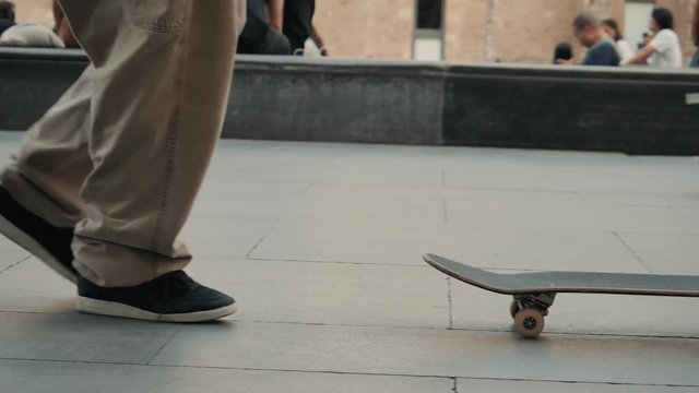 BARCELONA SPAIN 20 MAY 2019: Group of skaters  friends performing trick nollie flip noseslide in public MACBA park - Young men training with skateboards Extreme sport, youth lifestyle concept