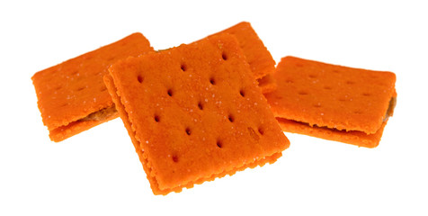 Cheese flavored peanut butter sandwich crackers on a white background side view