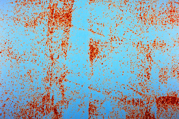 Old painted iron blue texture background. Painted grunge metal background with surface rust and paint crack.