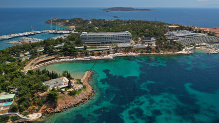 Obraz premium Aerial drone bird's eye panoramic photo of famous celebrity sandy beach of Astir or Asteras in south Athens riviera with turquoise clear waters, Vouliagmeni, Greece