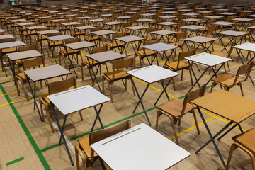 Exam tables set up in a sports hall for exams in a high school & sixth form