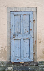 Architecture: Old blue wooden cassette door of a historical building in Eastern Germany
