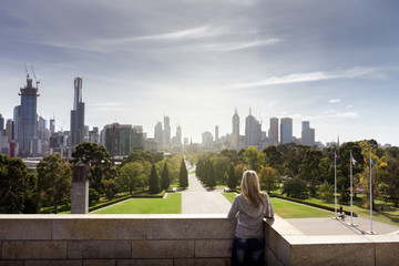Girl looking to Melbourne City skyline Australia