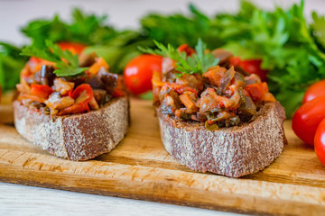 Close up home made aubergine pate or spread on rye bread