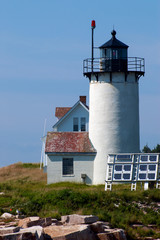 Fototapeta na wymiar Maine island lighthouse powered by solar panels. Great Dusk Island light is located in the Acadia National Park region.