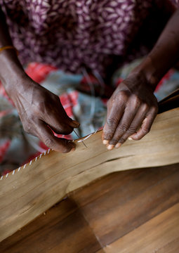 Woman Making A Traditional Skirt, Trobriand Island, Papua New Guinea