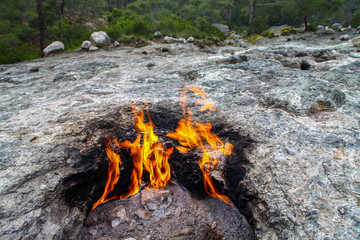 Yanartas burning stones is a geographical feature near the Olympos valley and national park in Antalya Province in southwestern Turkey