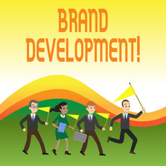 Writing note showing Brand Development. Business concept for Defining the product to excel in the market Promoting Crowd Flags Headed by Leader Running Demonstration Meeting