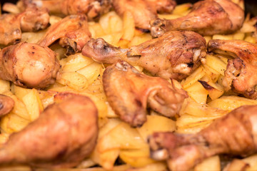Roast chicken wings and legs with potatoes